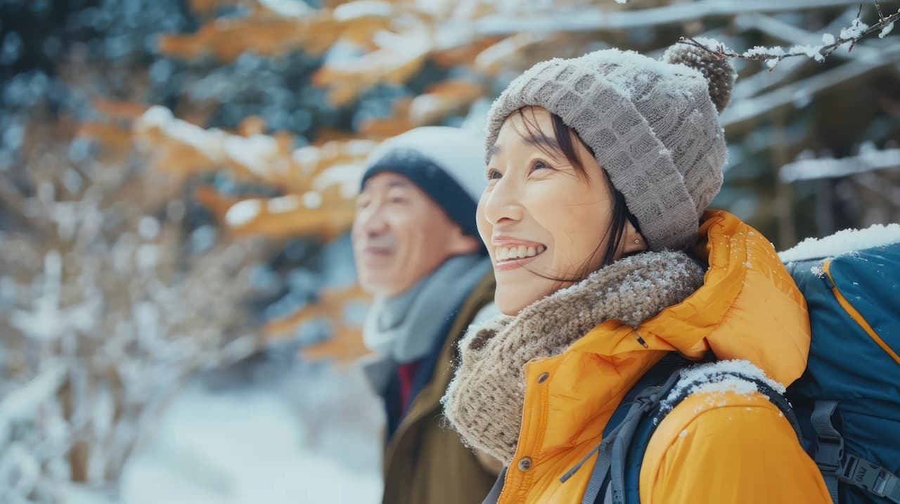 Retired couple hiking in the winter